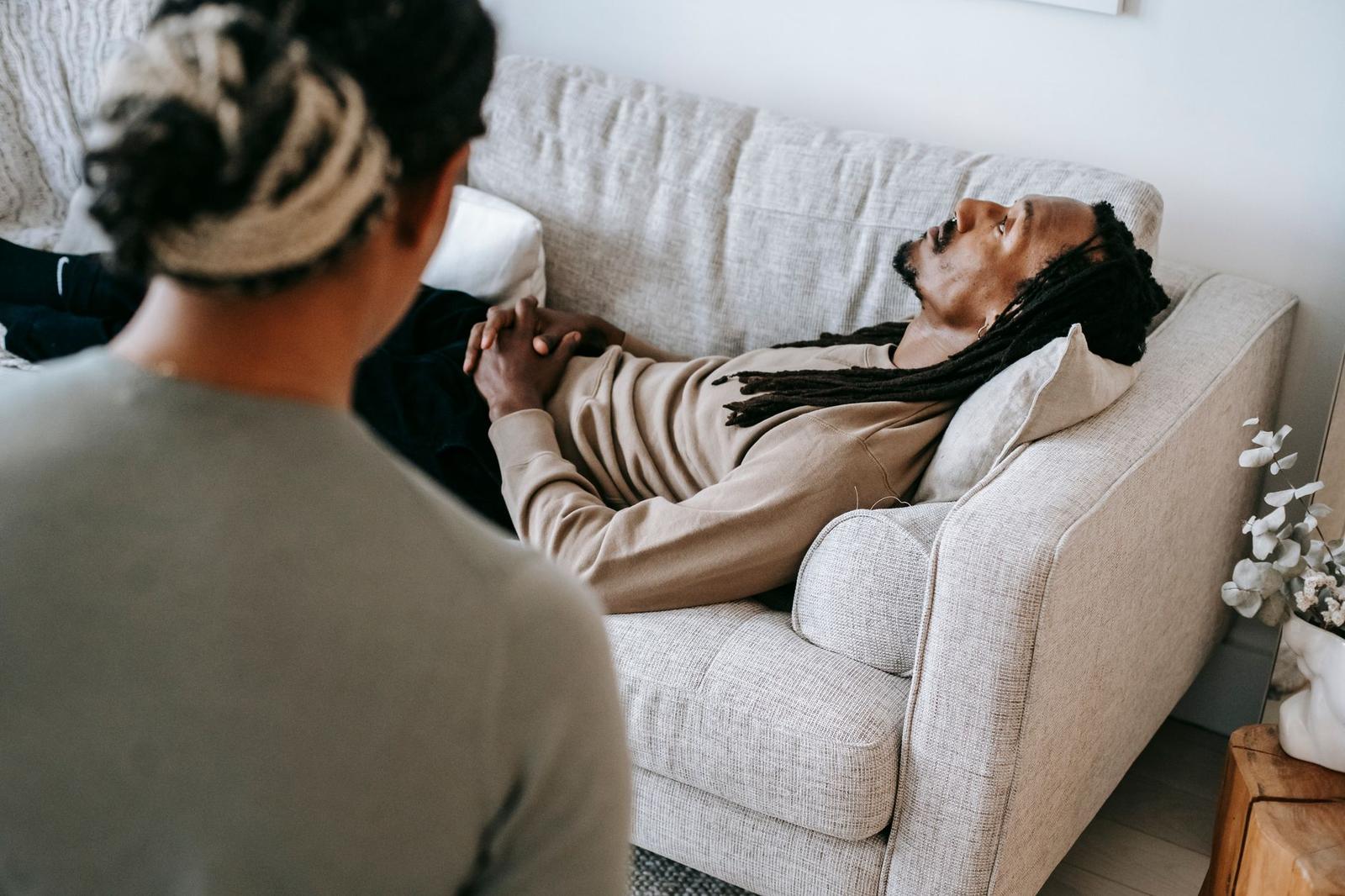 Black Man Lying on Sofa during Psychotherapy